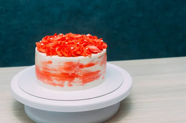 Ready coral and white sponge cake closeup. Blue background