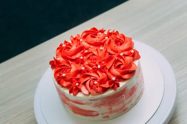 Ready coral and white sponge cake closeup. Blue background