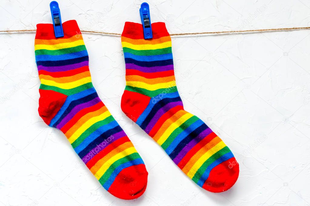 pair of rainbow-colored socks. Symbol LGBT
