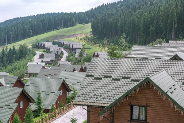 Cottage village houses in the forest in the mountains