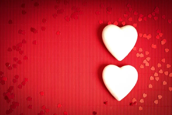 Valentines Day background with red ribbed paper with two white styrofoam hearts for lovers — Stock Photo, Image