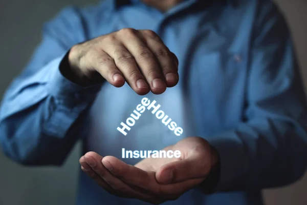 Businessman protect house insurance words. House insurance concept