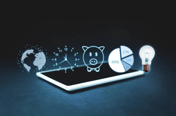 Globe, clock, piggy bank, pie graph and light bulb on digital tablet. Business concept