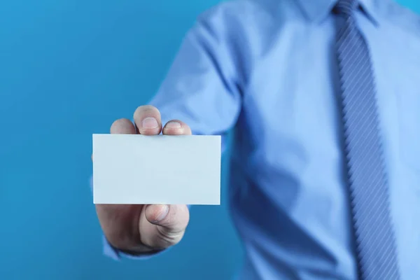 Businessman showing empty business card.
