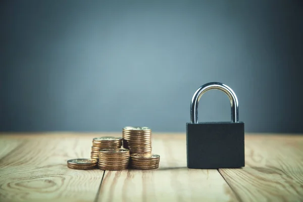Coins with padlock. Concept of financial security