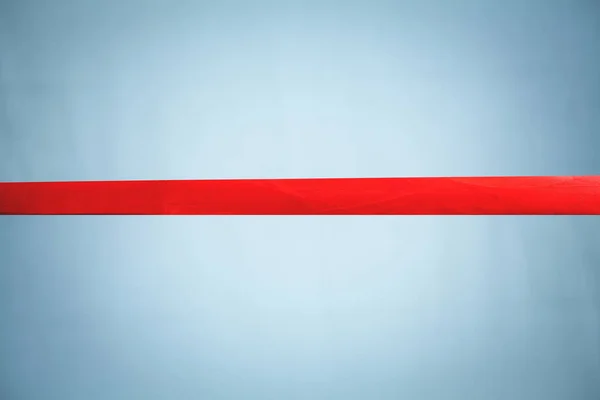 Red ribbon on white and blue background.