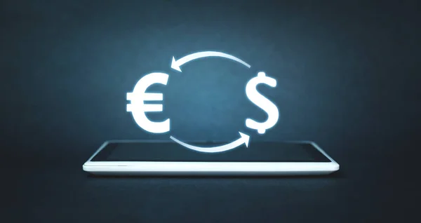 Euro and Dollar currency on a digital tablet. Concept of exchange