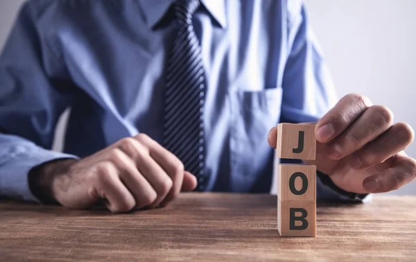 Empresario Sosteniendo Cubo Madera Con Palabra Trabajo — Foto de Stock