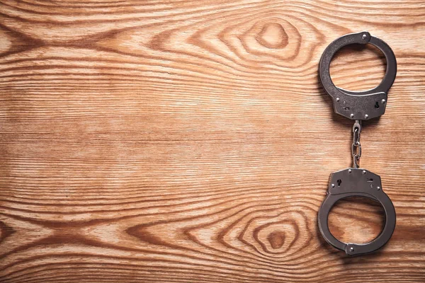 Metal Handcuffs Wooden Background Crime Law Concept — Stock Photo, Image