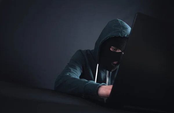 Hacker with laptop. Computer crime — Stock Photo, Image