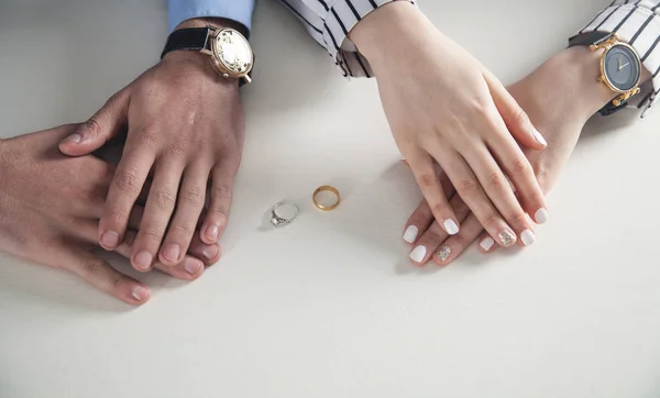 Man and woman hands with ring on desk. — Stock Photo, Image