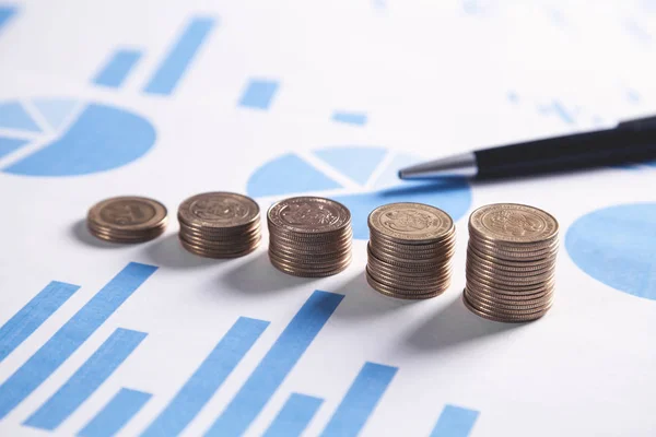 Coins and graphs. Financial concept — Stock Photo, Image