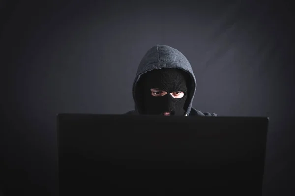 Hacker with laptop. Computer crime — Stock Photo, Image