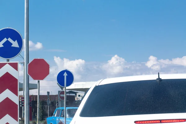 White car with road signs in the city. — Stock Photo, Image