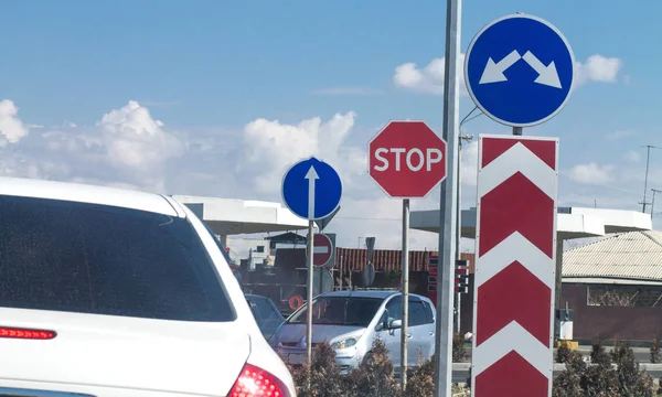 White car with road signs in the city. — Stock Photo, Image