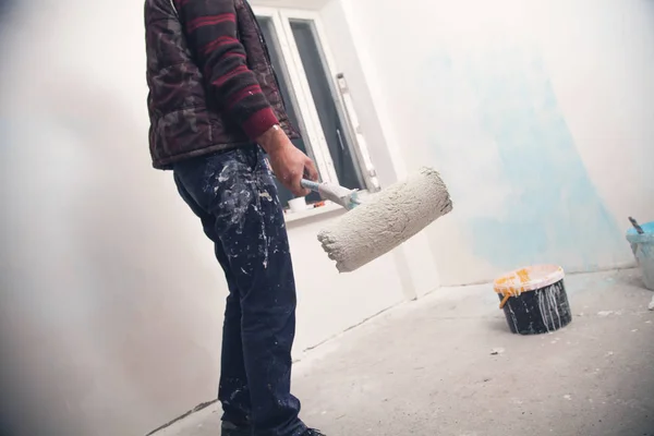 Professional painter with roller. Renovation — Stock Photo, Image