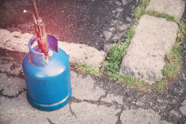 Blue gas bottle. Refueling gas balloon