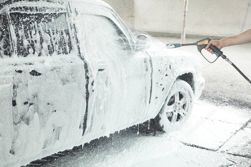 Car washing. The washing process on a self service car wash