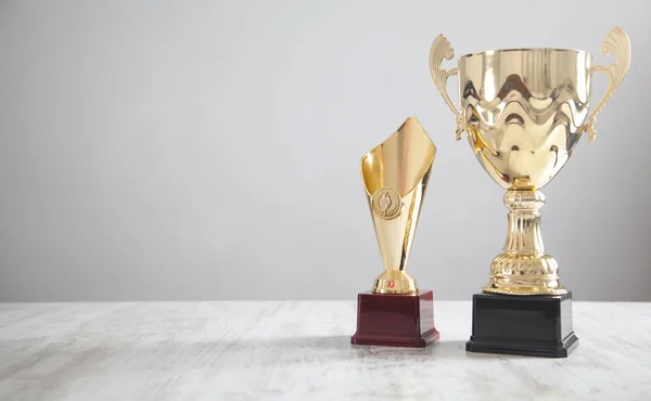 Golden trophy on white desk. Business, Success — Stock Photo, Image