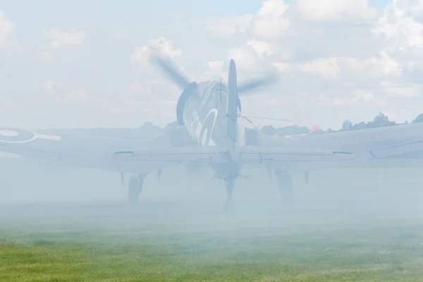 Oostwold, Netherlands May 25, 2015: Corsair covered by smoke — Stock Photo, Image