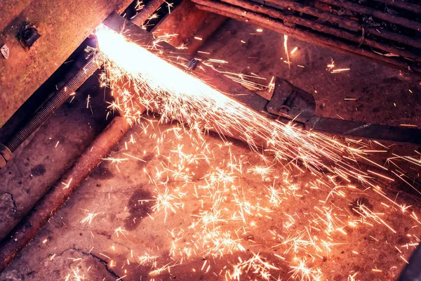 Steel Manufacturing Industry. Male welder cuts metal plasma.