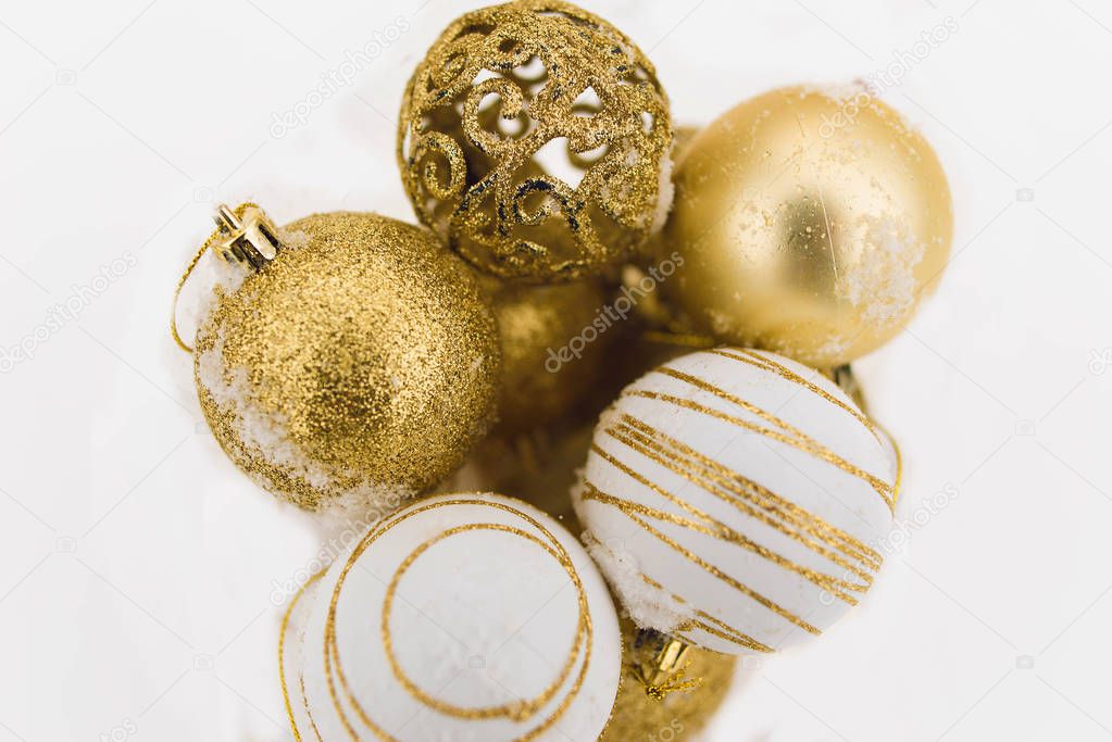 Christmas composition. Christmas balls, golden, white and silver ornaments on a white background