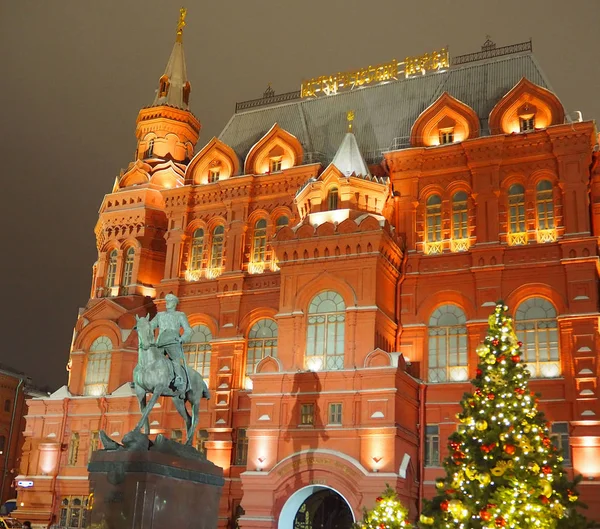 Monument to Marshal Zhukov near the walls of the night Kremlin, christmas trees at the walls of the historical museum