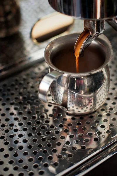 Professional espresso machine making strong  fresh coffee.