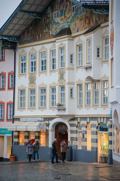 Bad Toelz, Germany - March 10, 2018: the famous old facades with historic murals in the old town Bad Toelz in rainy day