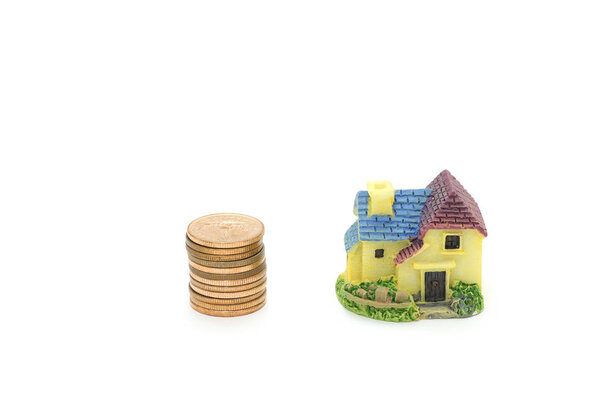 Isolated coin money and home on white background
