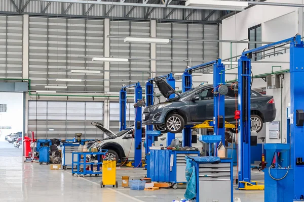 Car in the lifting equipment in the garage being repair and fix