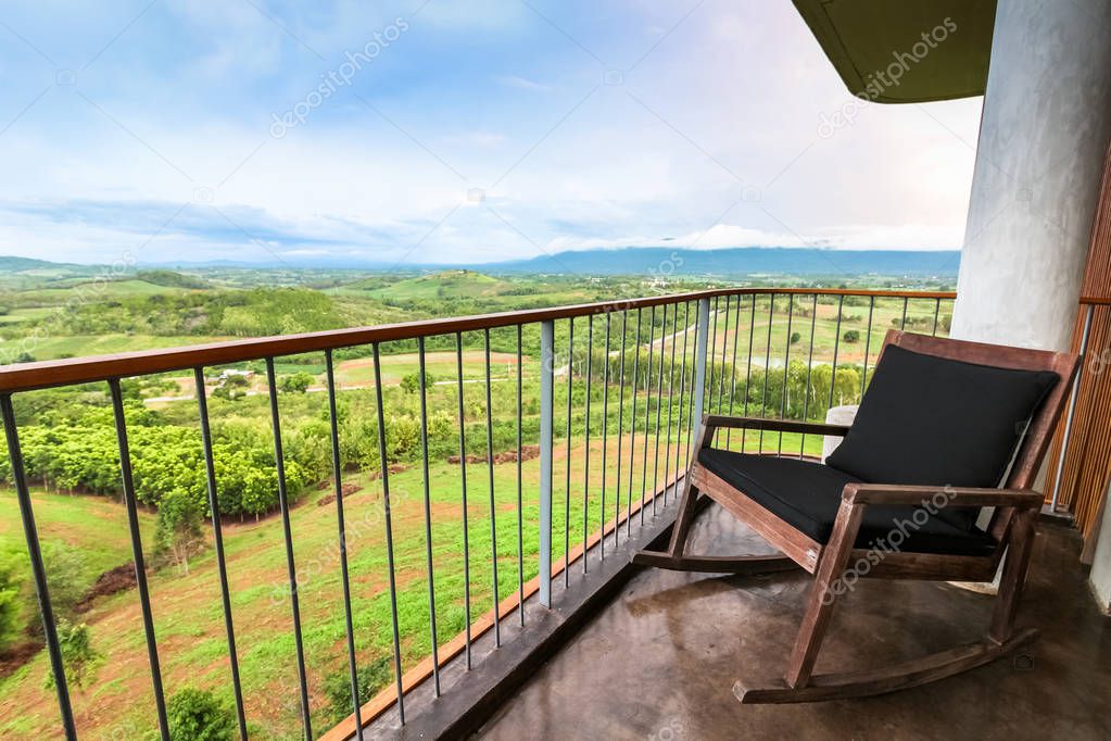 Chair on the high floor with beautiful view background, travel concept