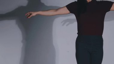 legs of a girl in a black leather skirt on a white background