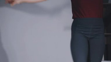 legs of a woman in black pants