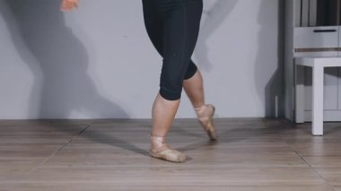 woman in a black dress in dance class