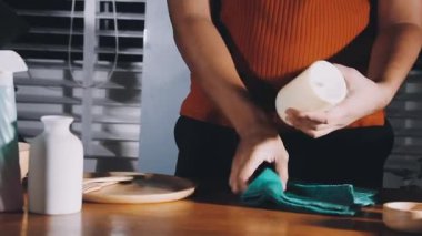 female hands washing dishes with white ceramic bowl