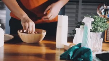 female hand holding bottle of water