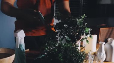 woman florist holding bouquet with fresh flowers