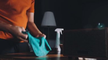 woman washing her hand in front of a bathroom.