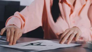 young woman writing a pen