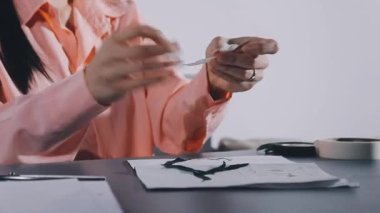 close up female hands writing on a notebook.