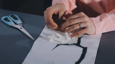 woman hands with white paper