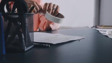woman working in a cafe. a man in a white shirt and black trousers