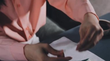 female hands holding a paper