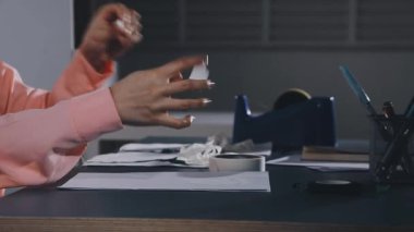 young asian business woman using a laptop in a office at night