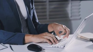close view of young businessman using computer in office