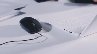 close up view of man using laptop computer at work