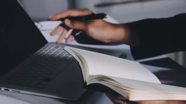 man working with laptop and documents in office