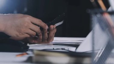 man using laptop at workplace in office