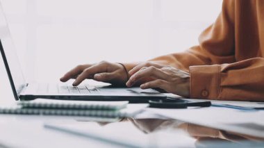 businessman working with laptop and calculator in modern office